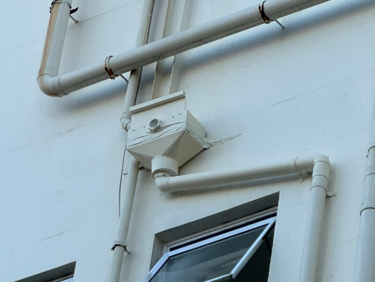 New overflow installed and fixed to facade