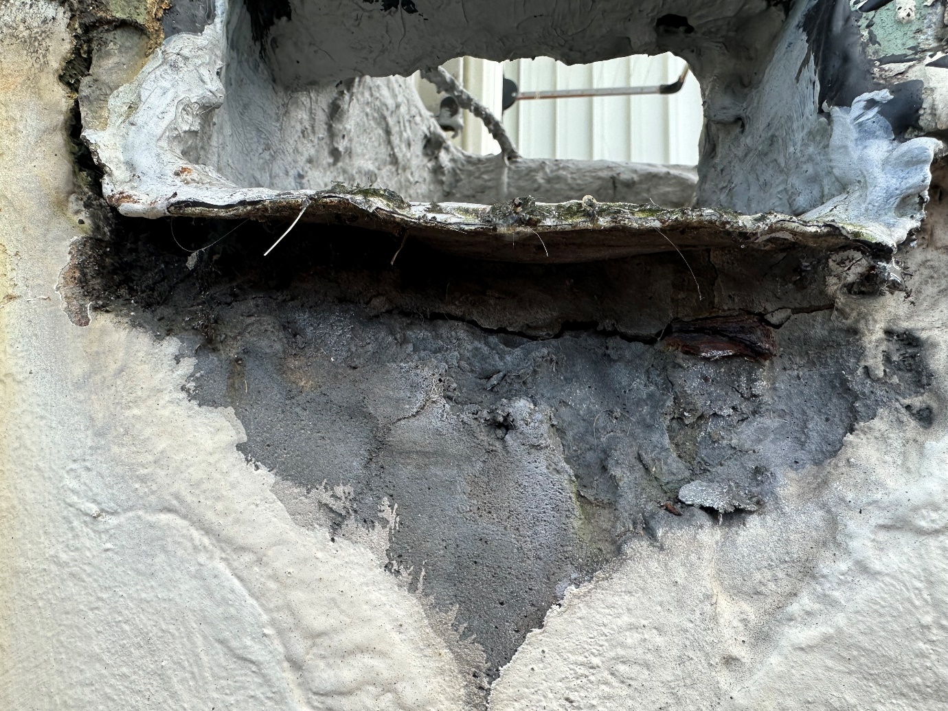 Structural crack behind overflow causing leaks photo