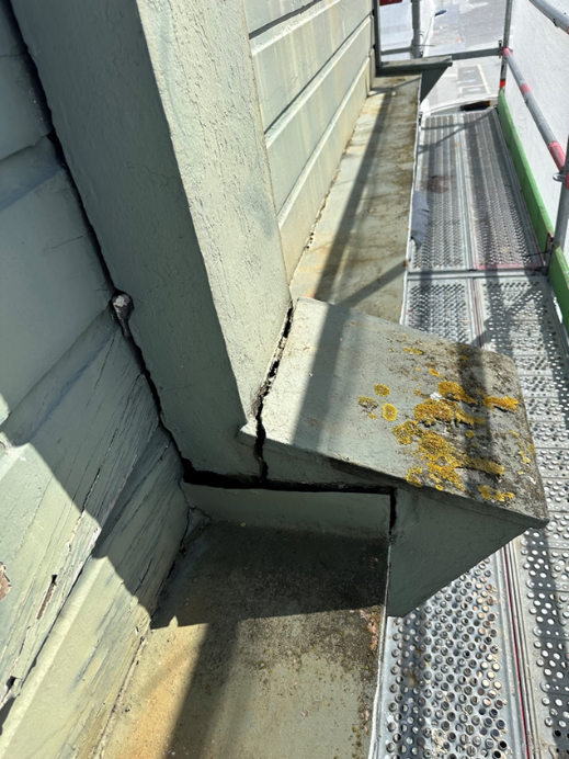 deteriorated weatherboards and flashing